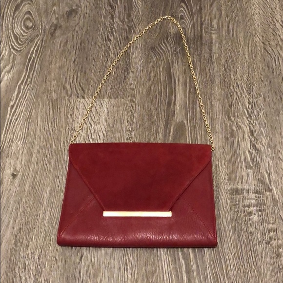 burgundy and gold clutch bag